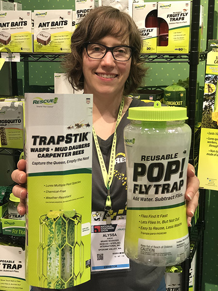 Alyssa shows off the packaging for the RESCUE! TrapStik for Wasps, Hornets & Carpenter Bees and the POP! Fly Trap