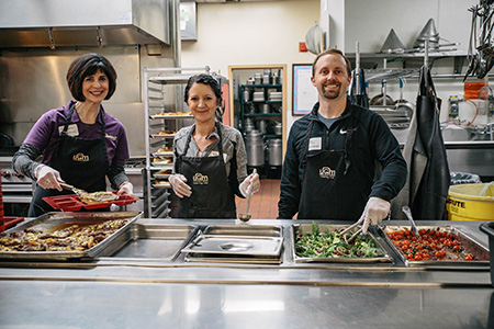 RESCUE! Pest Control employees serve a meal once a month to the homeless at the Union Gospel Mission in Spokane.